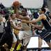 EMU junior Da'Shonte Riley maneuvers around Purdue defenders in the game on Saturday. Eastern Michigan won 47-44. Daniel Brenner I AnnArbor.com